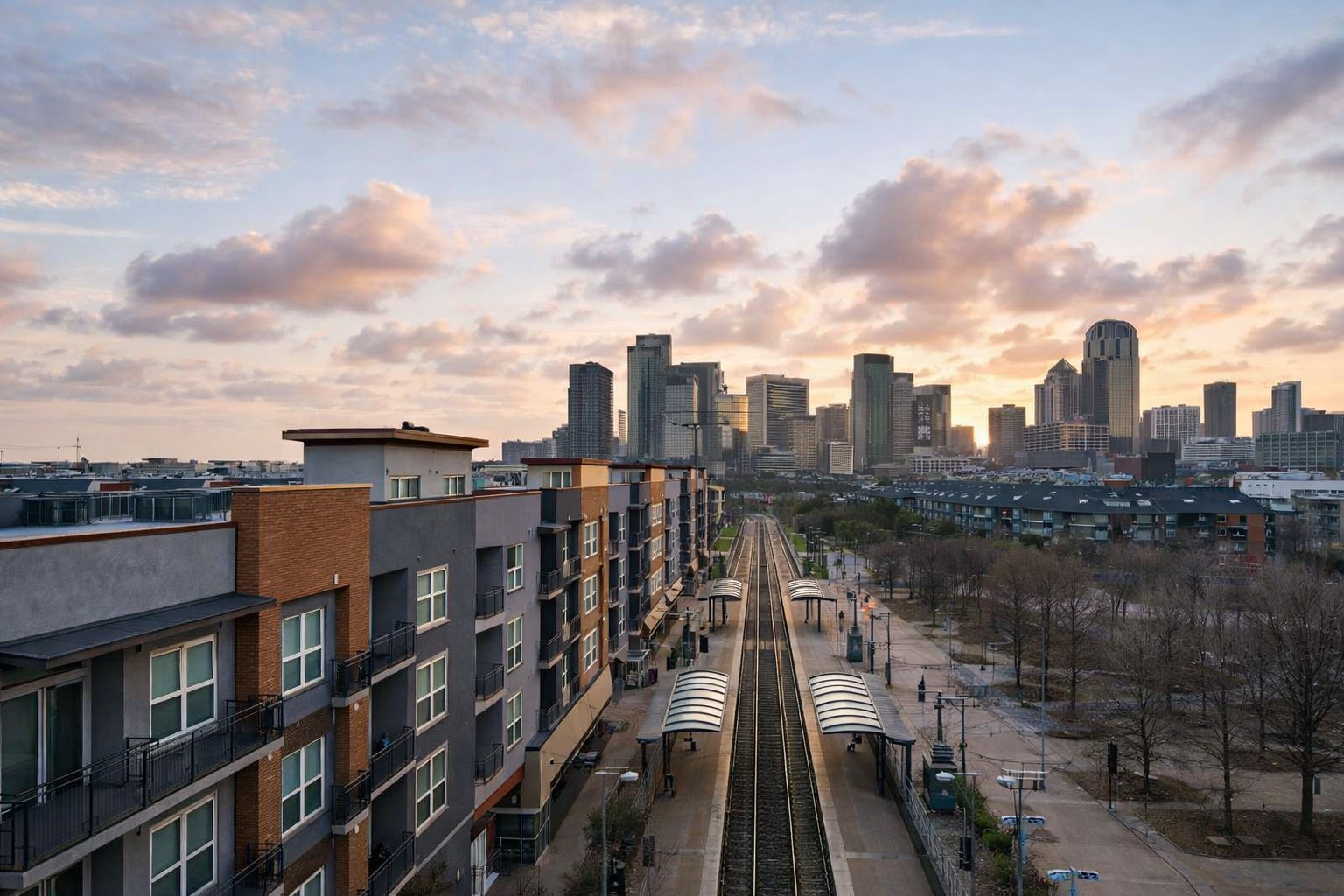 Wide Dallas skyline view above the rail line